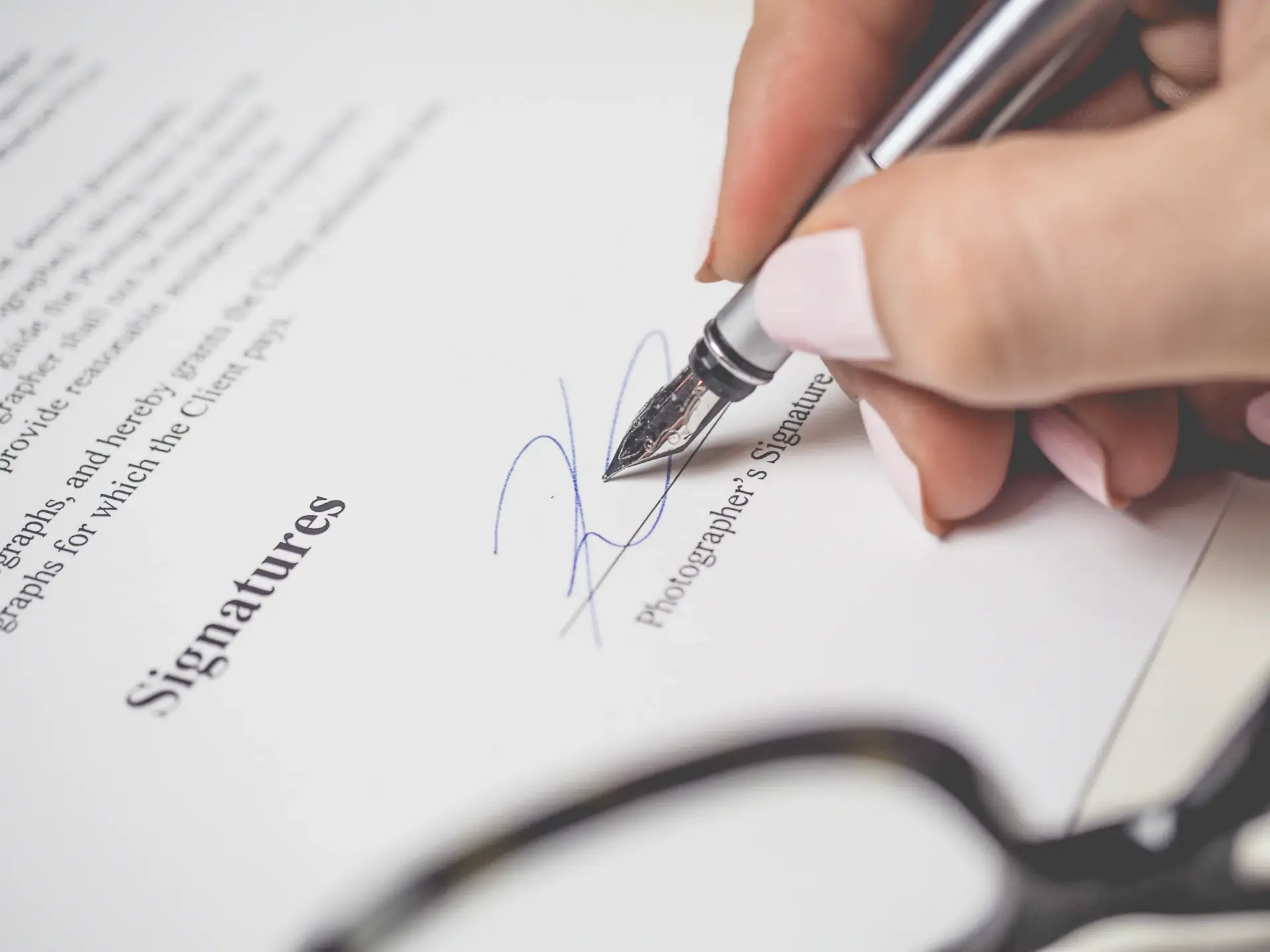 A translator signing a certificate of translation accuracy