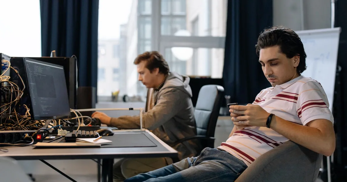Professionals calculating localization cost in a modern office.